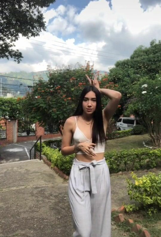 4. Sultry Val in White Crop Top