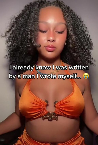 3. Titillating Veondre Mitchell Shows Cleavage in Orange Crop Top