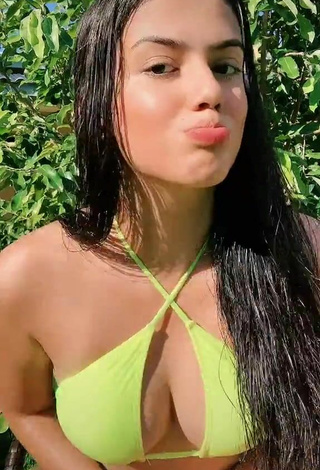 Attractive Victtoria Medeiros Shows Cleavage in Yellow Bikini Top