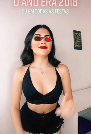 2. Luscious Vivi Shows Cleavage in Black Crop Top