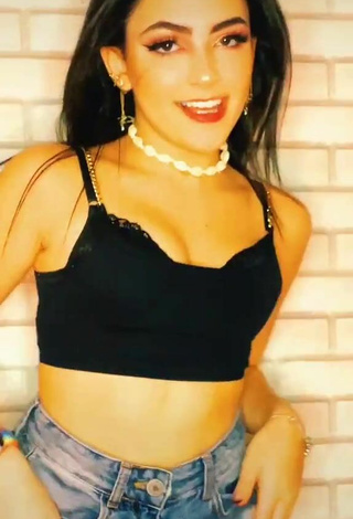 2. Titillating Vivi in Black Crop Top