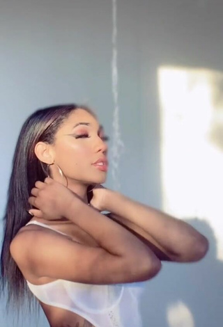 Sultry Bria Alana Shows Cleavage in White Bodysuit