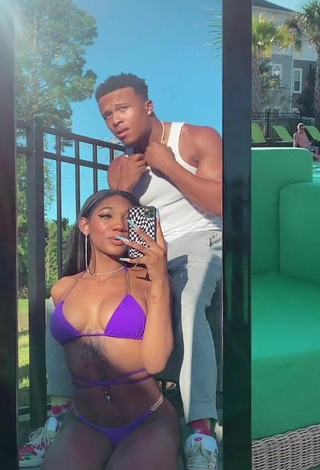 Sultry Bria Alana Shows Cleavage in Violet Bikini