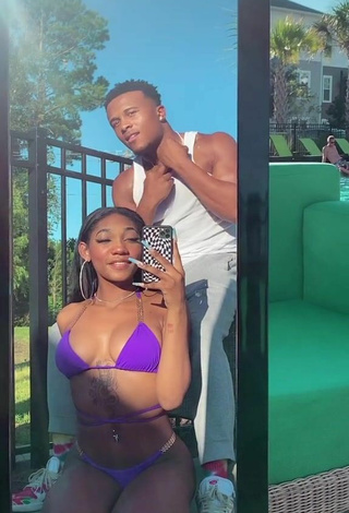 2. Sultry Bria Alana Shows Cleavage in Violet Bikini