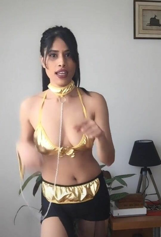 5. Sultry XENA Shows Cleavage in Golden Bra