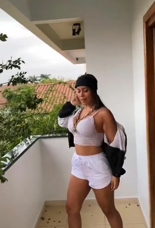 Sultry Dri Santos Shows Cleavage in White Crop Top