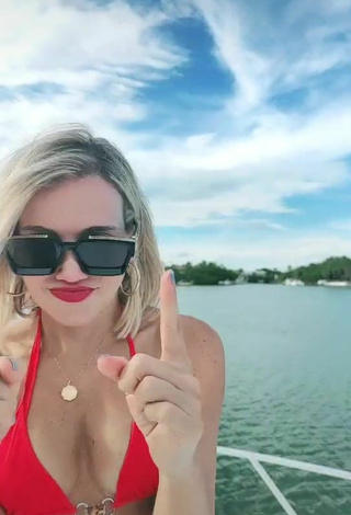 Luscious Fanny Lu Shows Cleavage in Red Bikini Top on a Boat