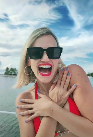 2. Luscious Fanny Lu Shows Cleavage in Red Bikini Top on a Boat