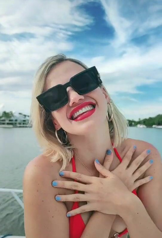 3. Luscious Fanny Lu Shows Cleavage in Red Bikini Top on a Boat