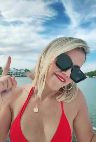 5. Luscious Fanny Lu Shows Cleavage in Red Bikini Top on a Boat