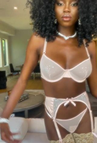 2. Titillating FashionNova Shows Cleavage in White Lingerie