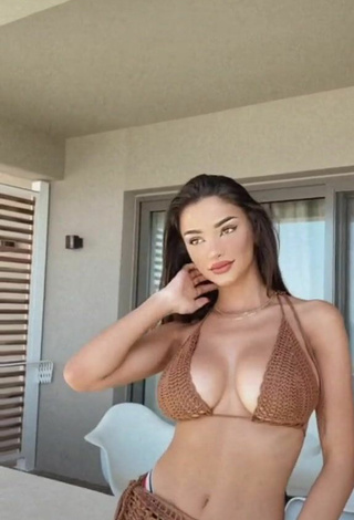 Sultry FashionNova Shows Cleavage in Brown Bikini Top in the Sea