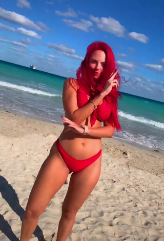 2. Luscious Jenny Devil Shows Cleavage in Red Bikini at the Beach