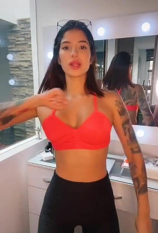 Beautiful Jenn Muriel Shows Cleavage in Sexy Orange Sport Bra