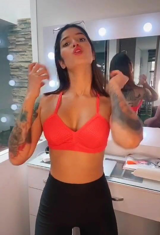 2. Beautiful Jenn Muriel Shows Cleavage in Sexy Orange Sport Bra