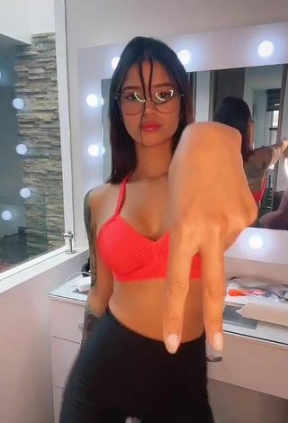 4. Beautiful Jenn Muriel Shows Cleavage in Sexy Orange Sport Bra