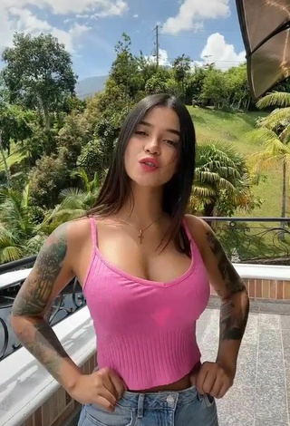 3. Titillating Jenn Muriel Shows Cleavage in Pink Crop Top on the Balcony