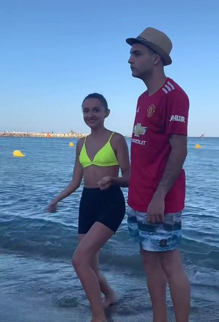 2. Sultry Larevuelta in Yellow Bikini Top at the Beach