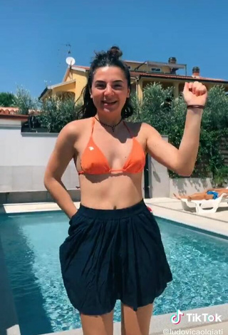 5. Sultry Ludovica Olgiati in Orange Bikini Top at the Swimming Pool