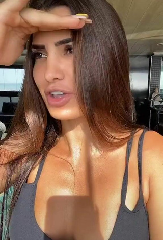 4. Sultry Marina Ferrari Shows Cleavage in Black Sport Bra