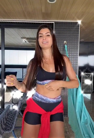 4. Luscious Marina Ferrari Shows Cleavage in Black Sport Bra