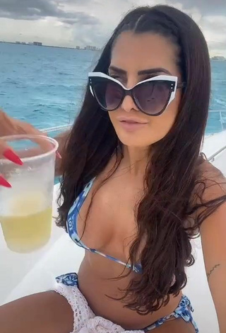 Luscious Marina Ferrari Shows Cleavage in Bikini on a Boat