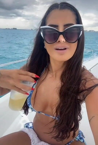 2. Luscious Marina Ferrari Shows Cleavage in Bikini on a Boat