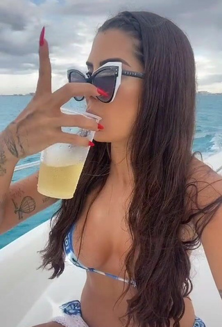 4. Luscious Marina Ferrari Shows Cleavage in Bikini on a Boat