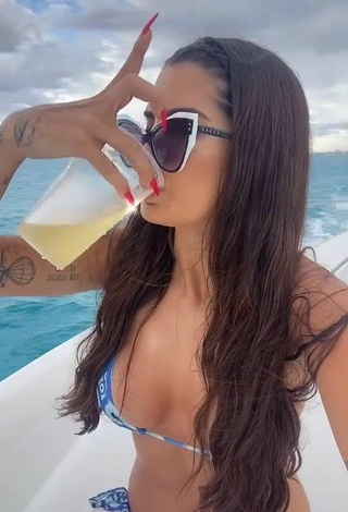 5. Luscious Marina Ferrari Shows Cleavage in Bikini on a Boat