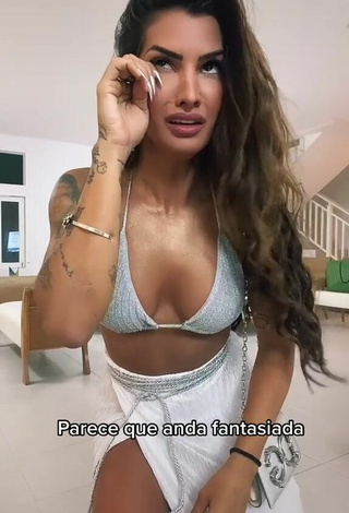 2. Seductive Marina Ferrari Shows Cleavage in Silver Bikini Top