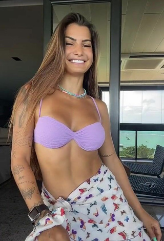 2. Titillating Marina Ferrari in Purple Bikini Top