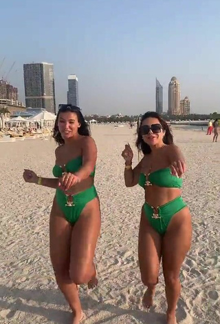 2. Sultry Nourhène Shows Cleavage in Green Bikini at the Beach