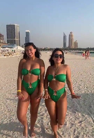 4. Sultry Nourhène Shows Cleavage in Green Bikini at the Beach