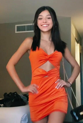 2. Luscious Rachel Brockman in Orange Dress