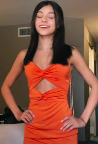 4. Luscious Rachel Brockman in Orange Dress