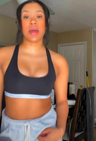 Sultry Thyri Frazier Shows Cleavage in Black Sport Bra and Bouncing Breasts