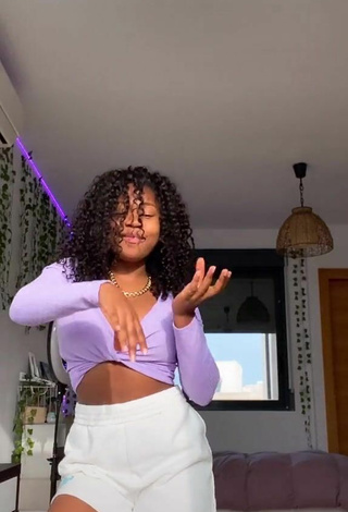 Cute Tania Fernández Shows Cleavage in Purple Crop Top