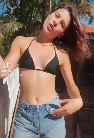 Titillating Agustina Palma in Black Bikini Top