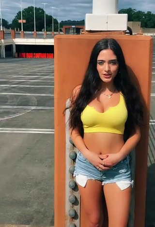 Sultry Ansley Spinks Shows Cleavage in Crop Top