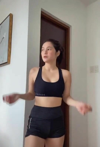 Sultry Barbie Imperial Shows Cleavage in Black Sport Bra