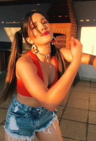 Sultry Bya Kessey Shows Cleavage in Red Crop Top