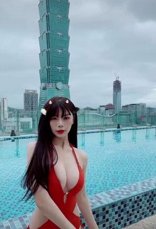 5. Titillating c.0214 Shows Cleavage in Red Swimsuit at the Pool