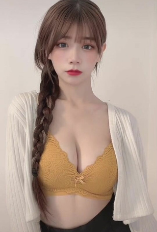 3. Sultry c.0214 Shows Cleavage in Yellow Bra