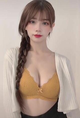 4. Sultry c.0214 Shows Cleavage in Yellow Bra