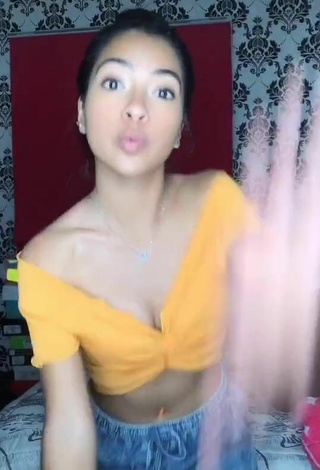 2. Titillating Dayana Shows Cleavage in Orange Crop Top