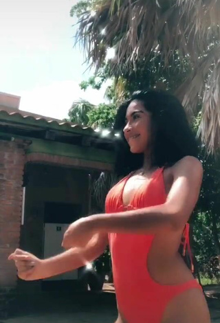 3. Sultry Dayana in Orange Swimsuit