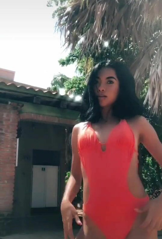 4. Sultry Dayana in Orange Swimsuit