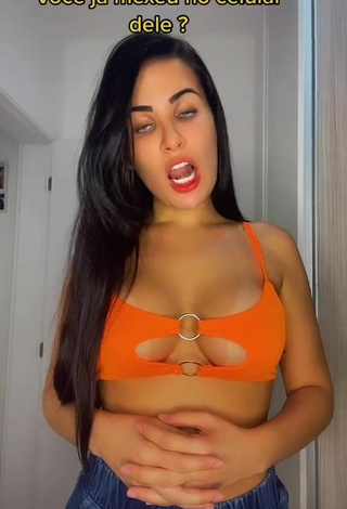 Sexy Dine Azevedo Shows Cleavage in Orange Crop Top