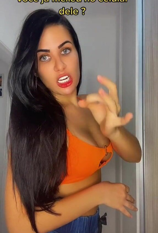 2. Sexy Dine Azevedo Shows Cleavage in Orange Crop Top