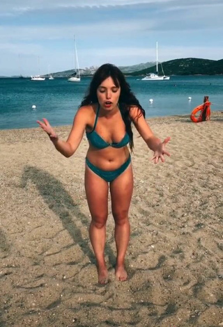 5. Luscious Eleonora Olivieri Shows Cleavage in Turquoise Bikini at the Beach and Bouncing Boobs